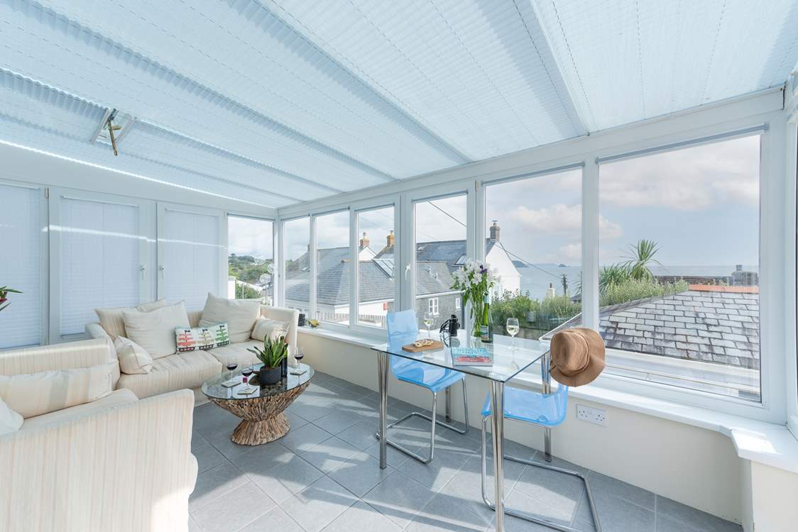 The conservatory looks out towards Gerrans Bay with Gull Rock in the distance.