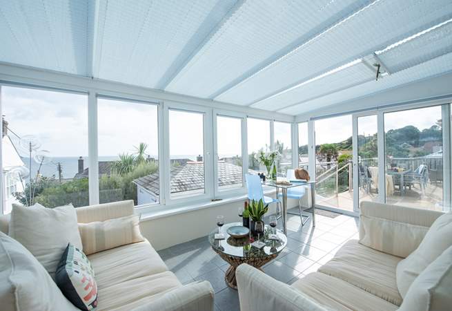 The beautiful conservatory is perfectly positioned to make the most of the sea views.
