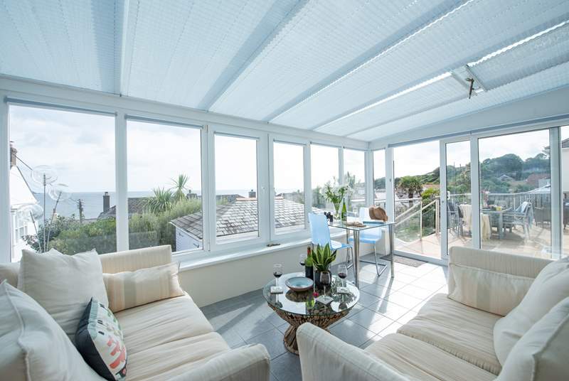 The beautiful conservatory is perfectly positioned to make the most of the sea views.