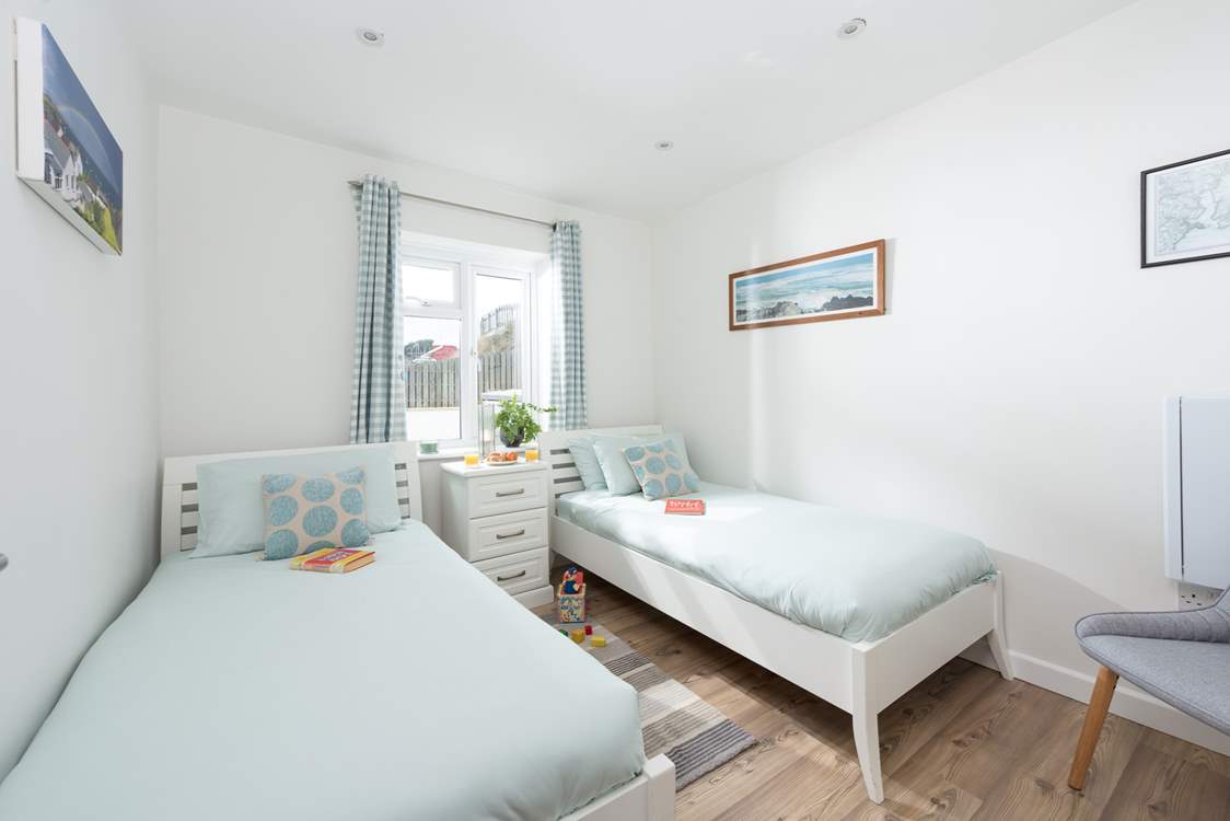 The twin bedroom is light and bright.