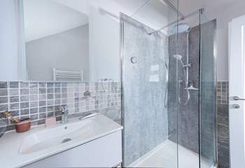 The super en suite to bedroom 1 has a rainfall shower, perfect for rinsing salty toes after a beach day.
