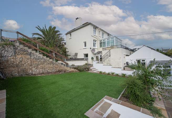 The steps lead down from the allocated parking space to Four Winds. Step access is shared with the house in the centre of the picture however the astro turf lawn at the rear belongs to Four Winds. 