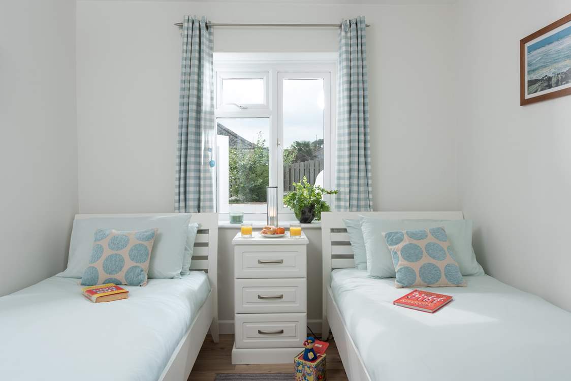 There is a step into delightful bedroom 3 with twin beds, ideal for either adults or children.