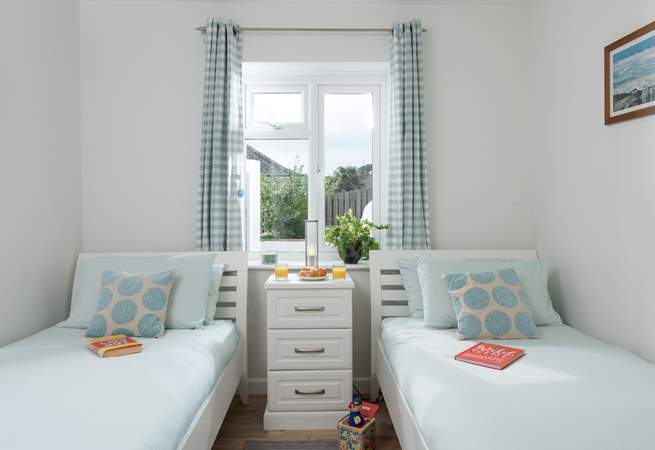 There is a step into delightful bedroom 3 with twin beds, ideal for either adults or children.