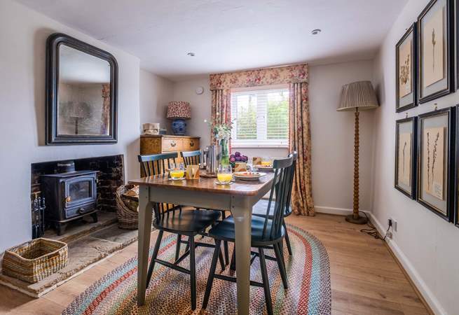 The dining-room has a wood-burner to keep you cosy in cooler months.