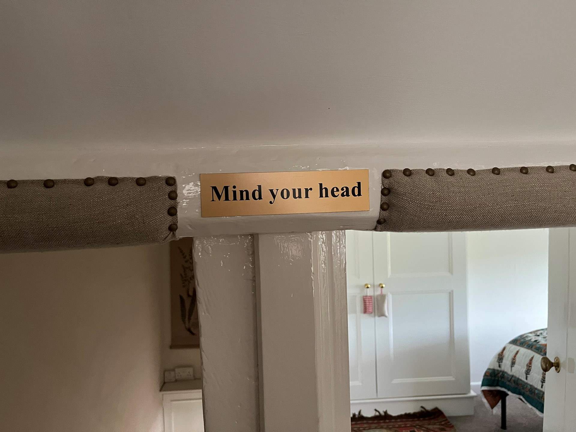 Please note that at the top of the stairs there is a low beam, and the bedroom doorways are low.