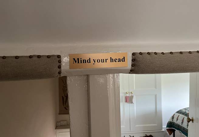 Please note that at the top of the stairs there is a low beam, and the bedroom doorways are low.