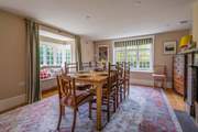 The spacious dining-room has dual aspect windows and a delightful window seat.