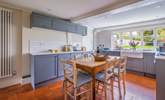 The traditional farmhouse table in the kitchen. Pull up a chair, grab a pot of tea and a slice of cake and enjoy planning holiday adventures. - Thumbnail Image