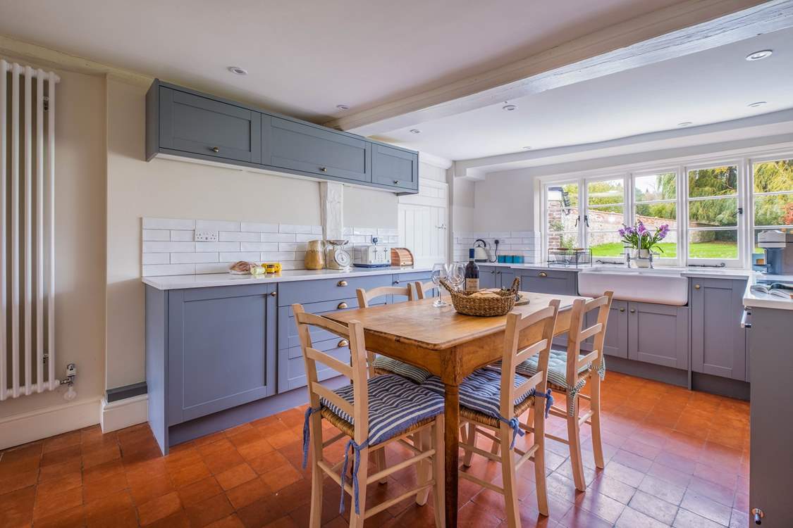 The traditional farmhouse table in the kitchen. Pull up a chair, grab a pot of tea and a slice of cake and enjoy planning holiday adventures.