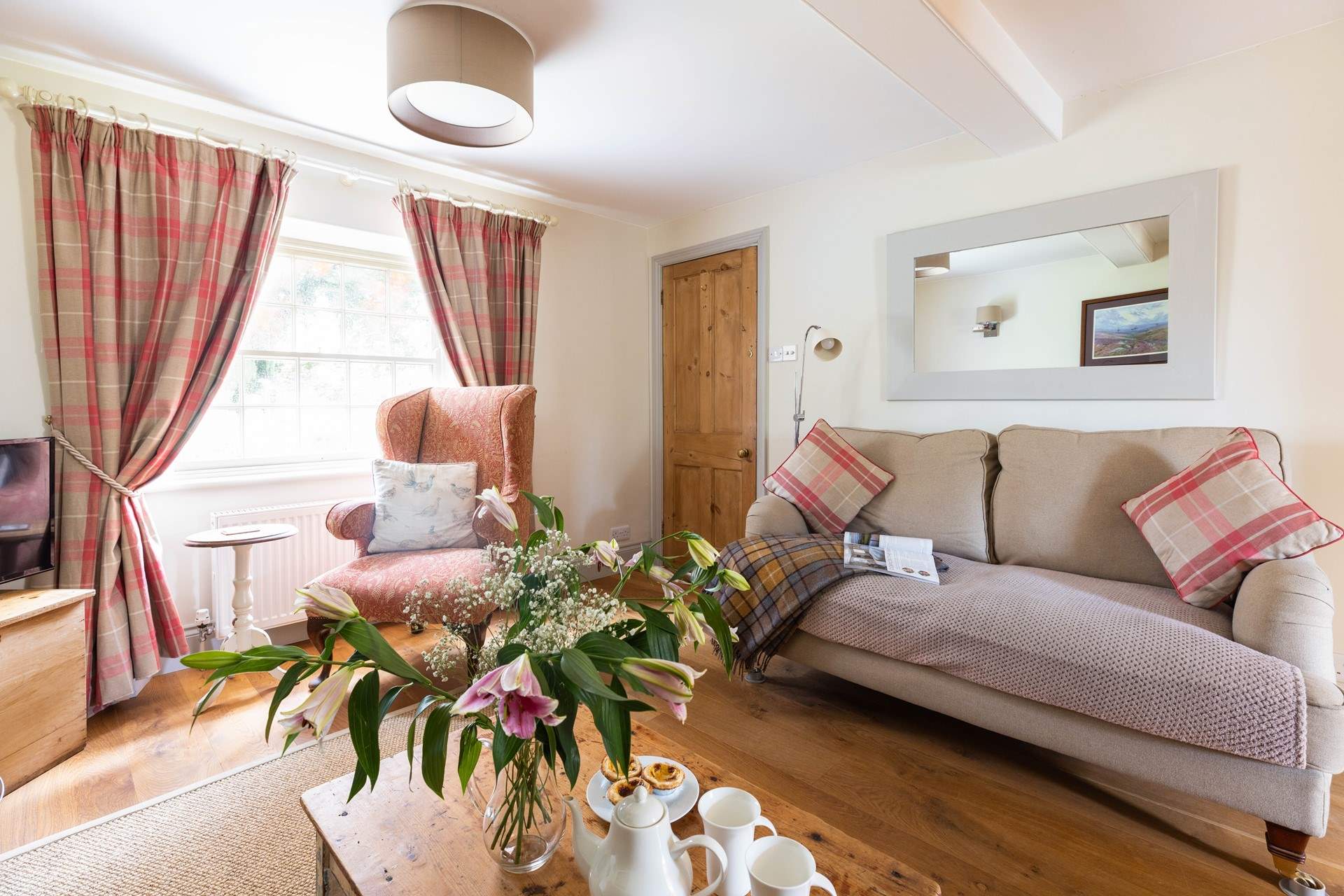 Relax on the comfy sofa in front of the TV.