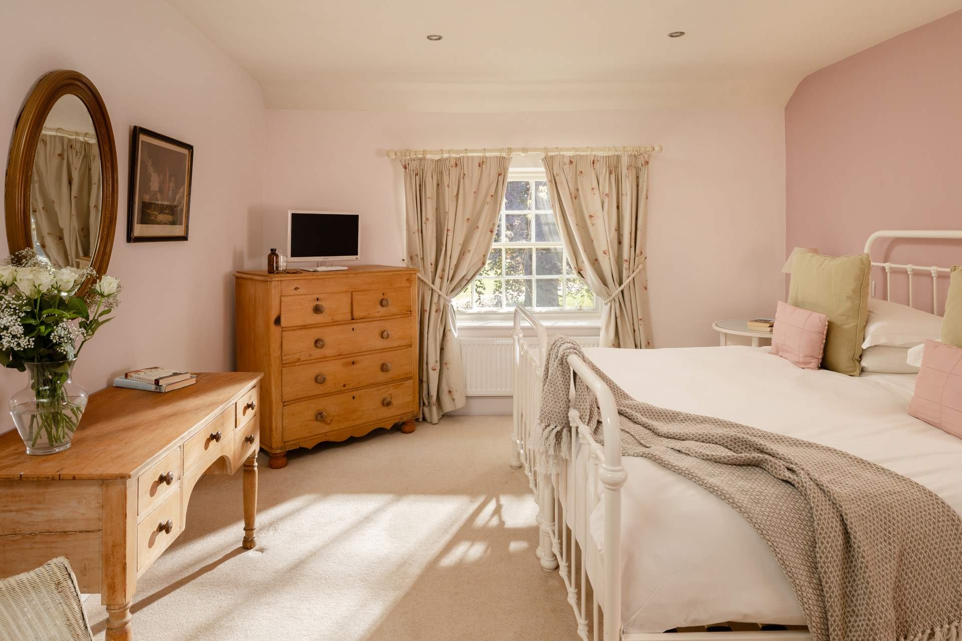The pretty bedroom has a 'zip and link' bed so you can choose either twins or a super-king double bed.