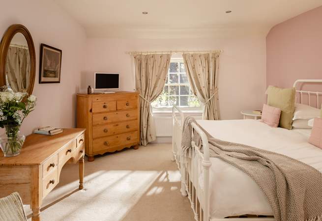 The pretty bedroom has a 'zip and link' bed so you can choose either twins or a super-king double bed.
