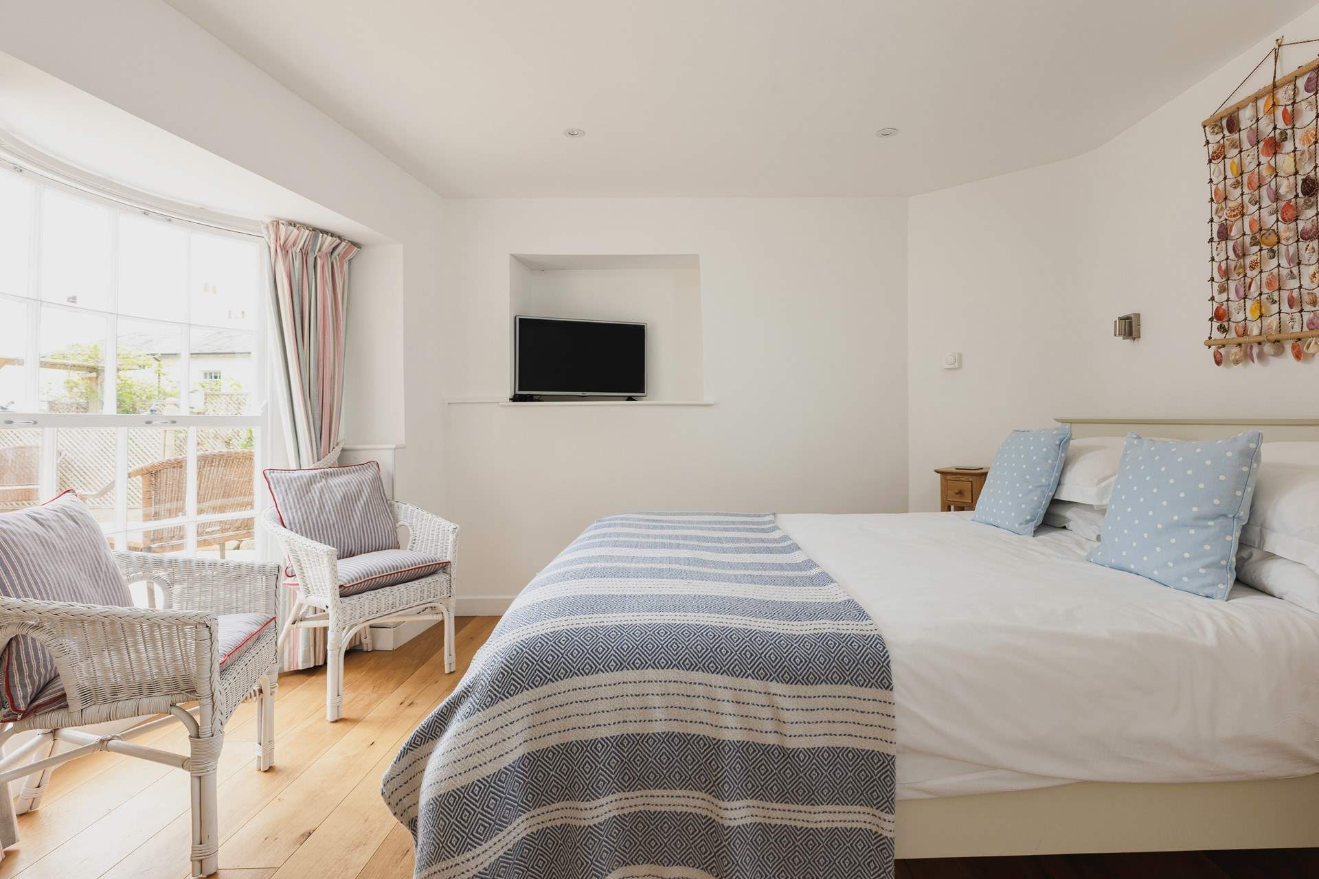 This pretty bedroom is a relaxing spot for anyone wanting a moments peace after a day spent exploring.