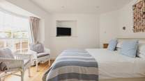 This pretty bedroom is a relaxing spot for anyone wanting a moments peace after a day spent exploring.