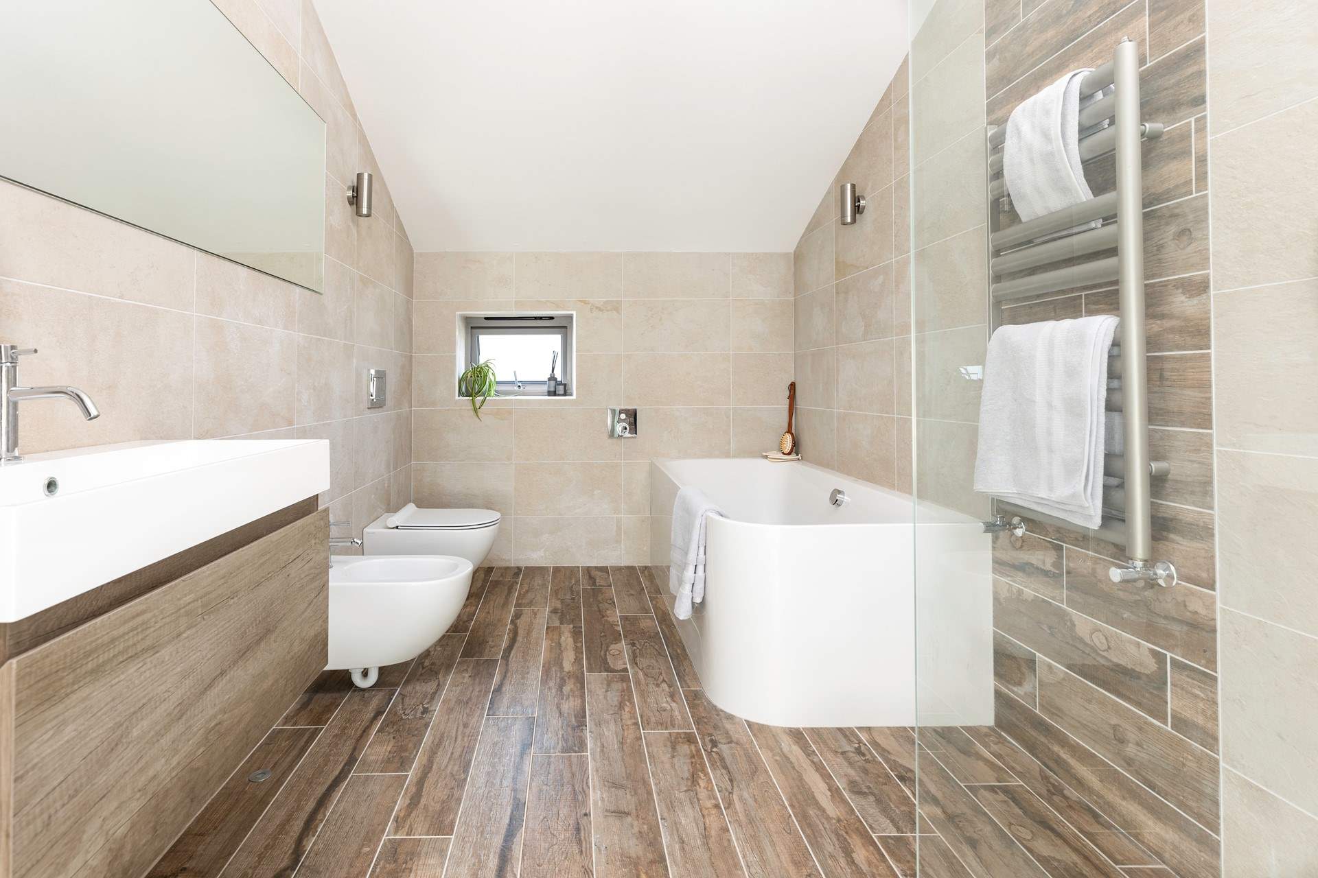 The stunning family bathroom offers the ideal place to relax after a busy day.