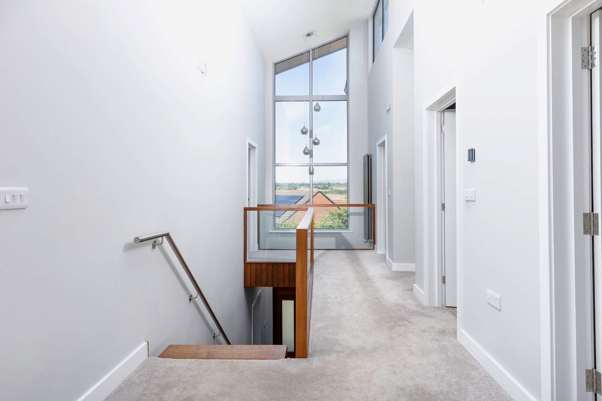 Another fabulous window illuminates the upstairs landing.