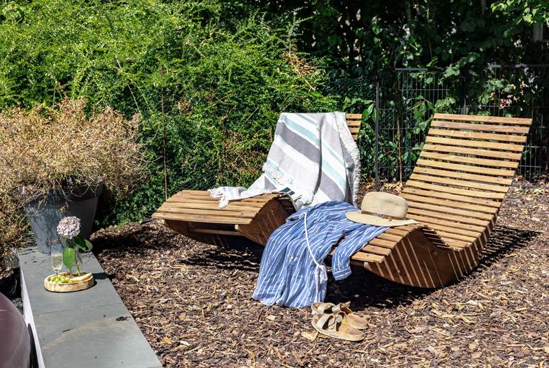 Soak up the rays on the beautiful timber sun loungers.