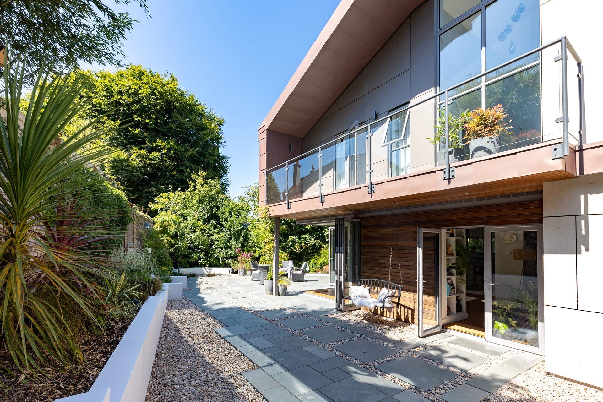 A stunning balcony offers views across the garden.