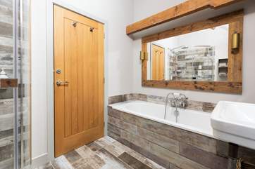 The bathroom is stylish and spacious.