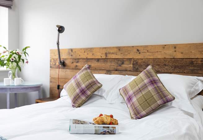 Stylish bedhead with useful reading lights.