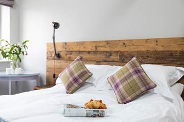 Stylish bedhead with useful reading lights.