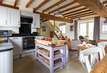 Beautiful beams grace the open plan living area.