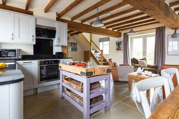 Beautiful beams grace the open plan living area.