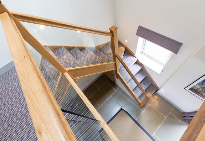 Staircase with contemporary glass bannisters.