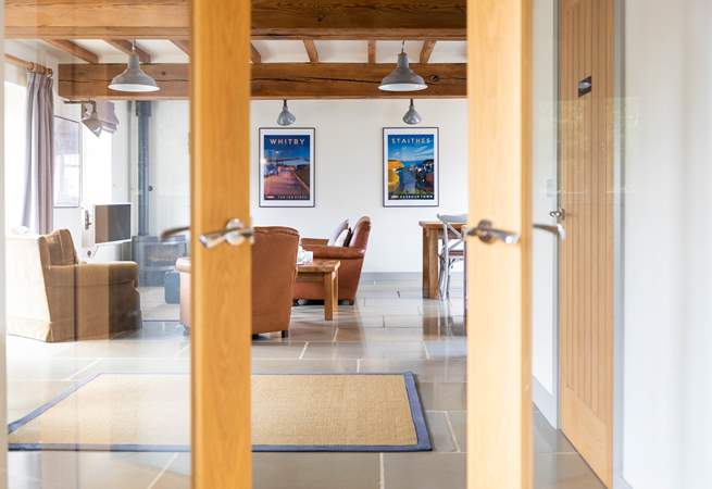 The large entrance hall leads into the open plan living space.