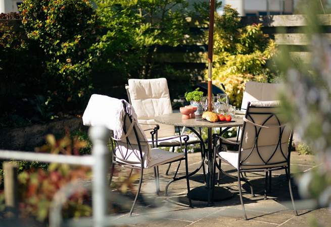 Relax in the beautifully tended garden.