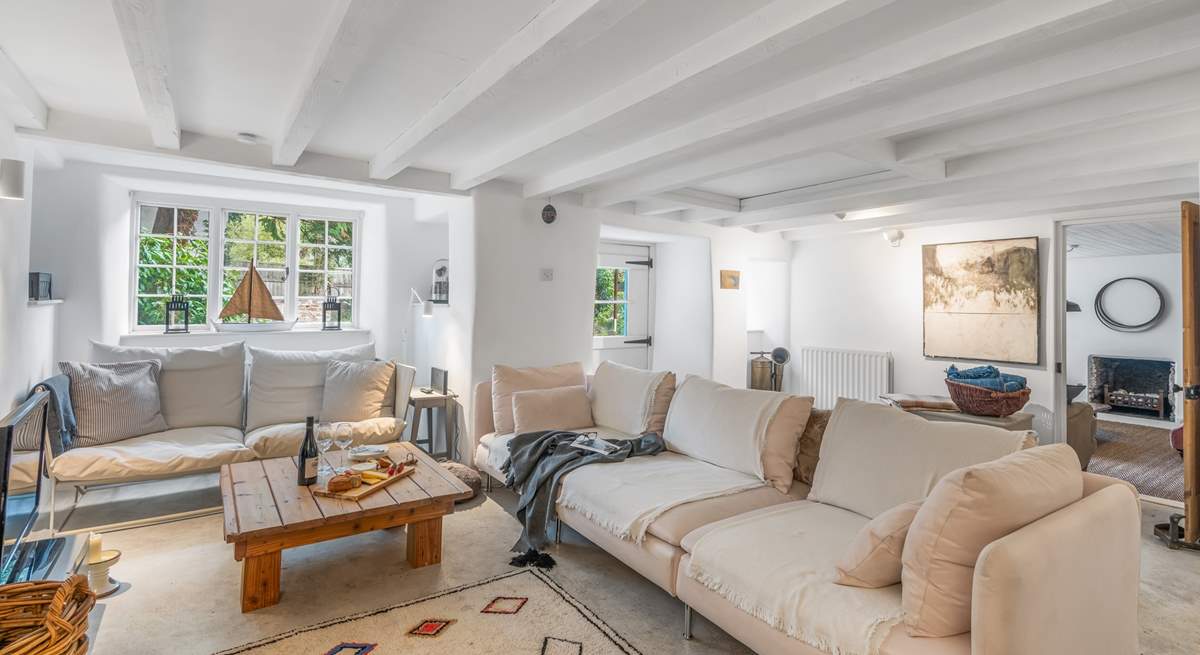 The cosy sitting-room has a Smart TV and Sky. The sitting-room is also linked to the snug via the door at the rear of the room, please mind the step when stepping down into the snug.