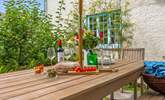 Enjoy al fresco dining in the pretty garden. - Thumbnail Image