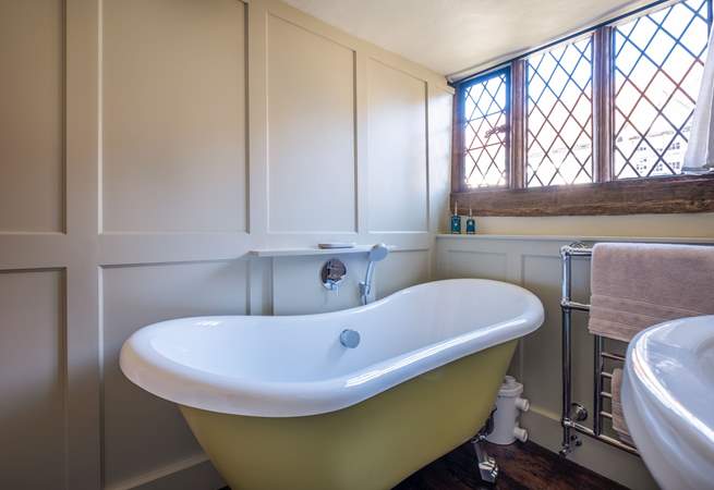 The bathroom has a gorgeous Victorian roll-top bath.
