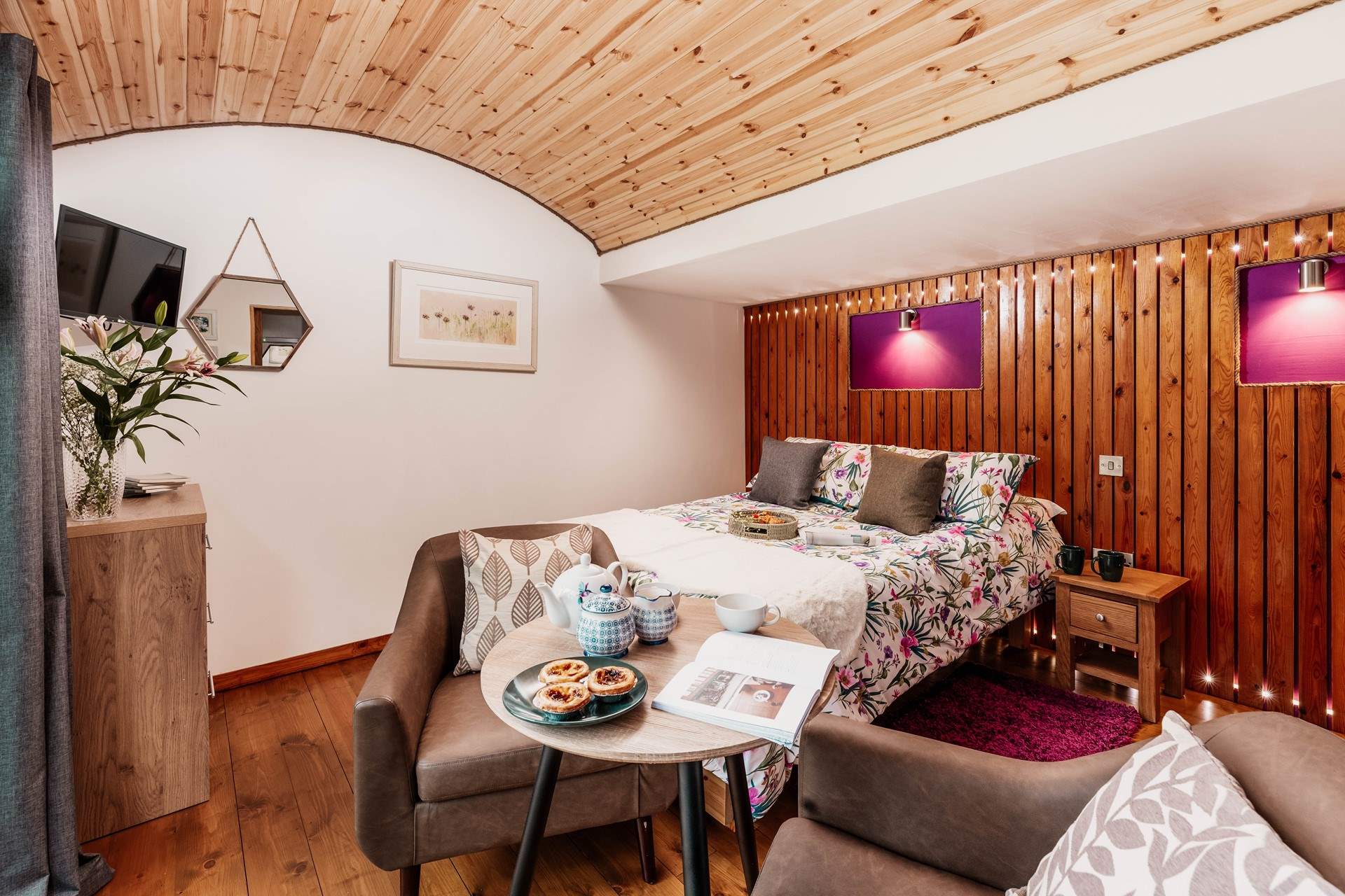 The curved ceiling and wooden panels create the cosiest atmosphere.