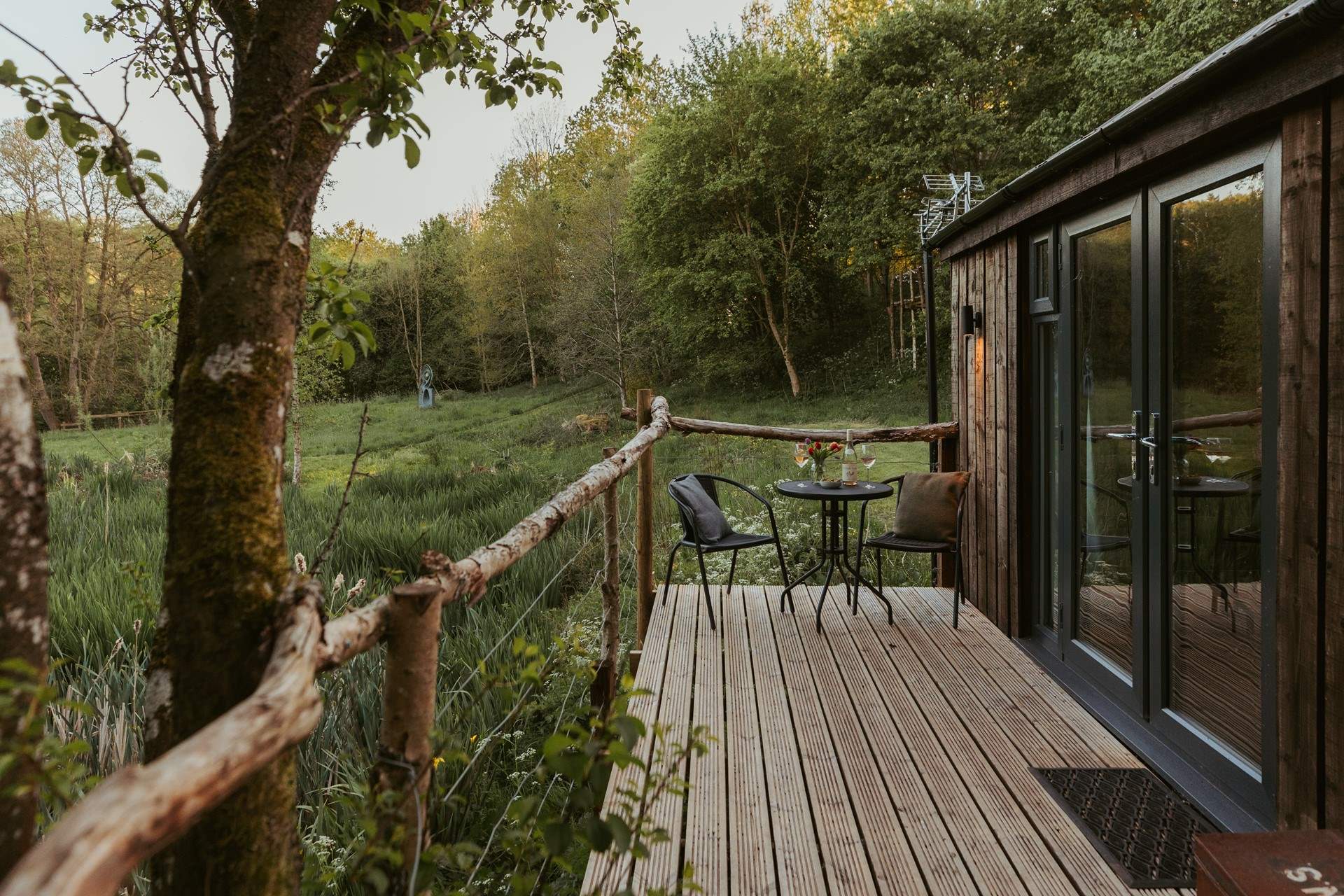 The lovely raised decking is made from reclaimed branches.