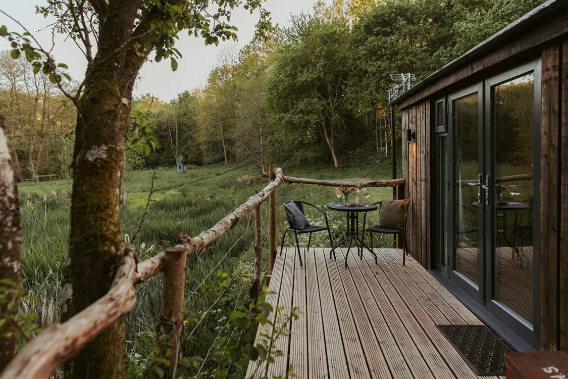 The lovely raised decking is made from reclaimed branches.