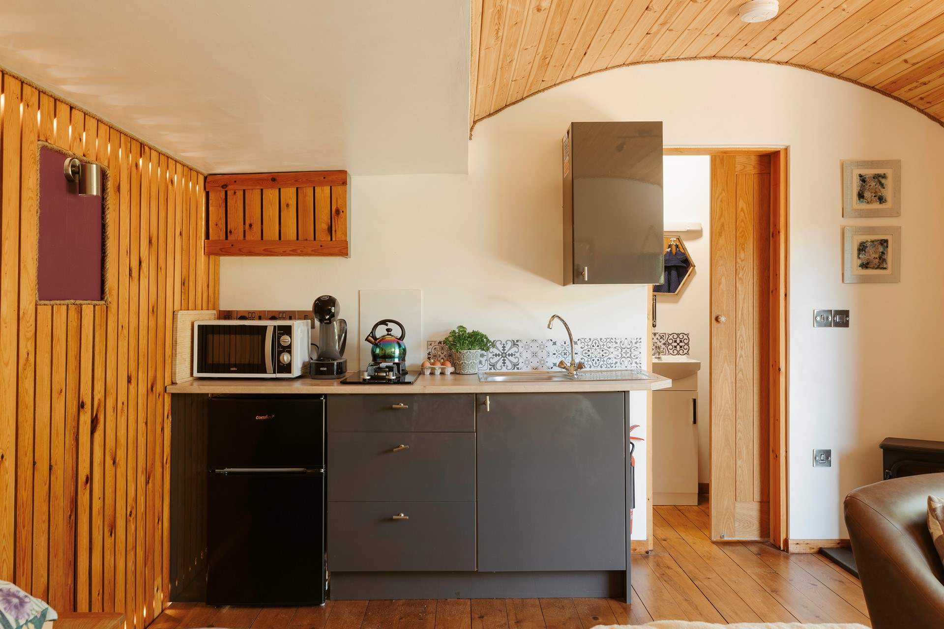 The stylish kitchen area is complete with all the essentials.