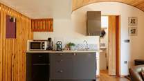 The stylish kitchen area is complete with all the essentials.