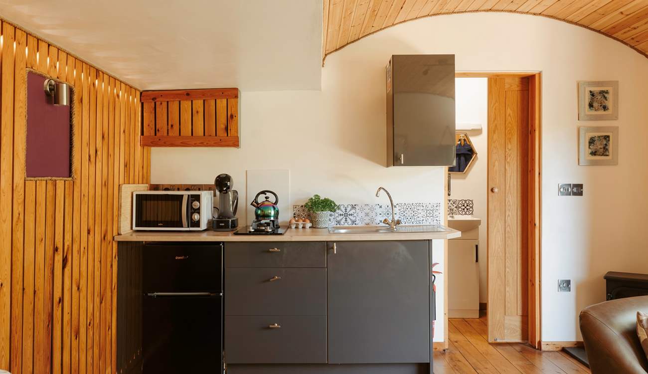 The stylish kitchen area is complete with all the essentials.