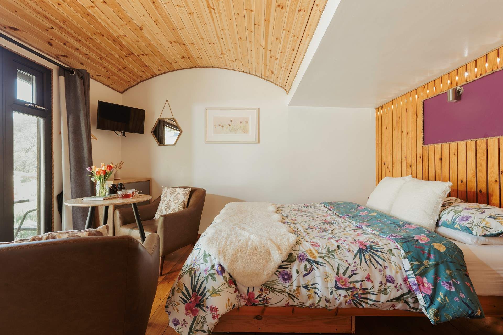 The curved ceiling and wooden panels create the cosiest atmosphere.