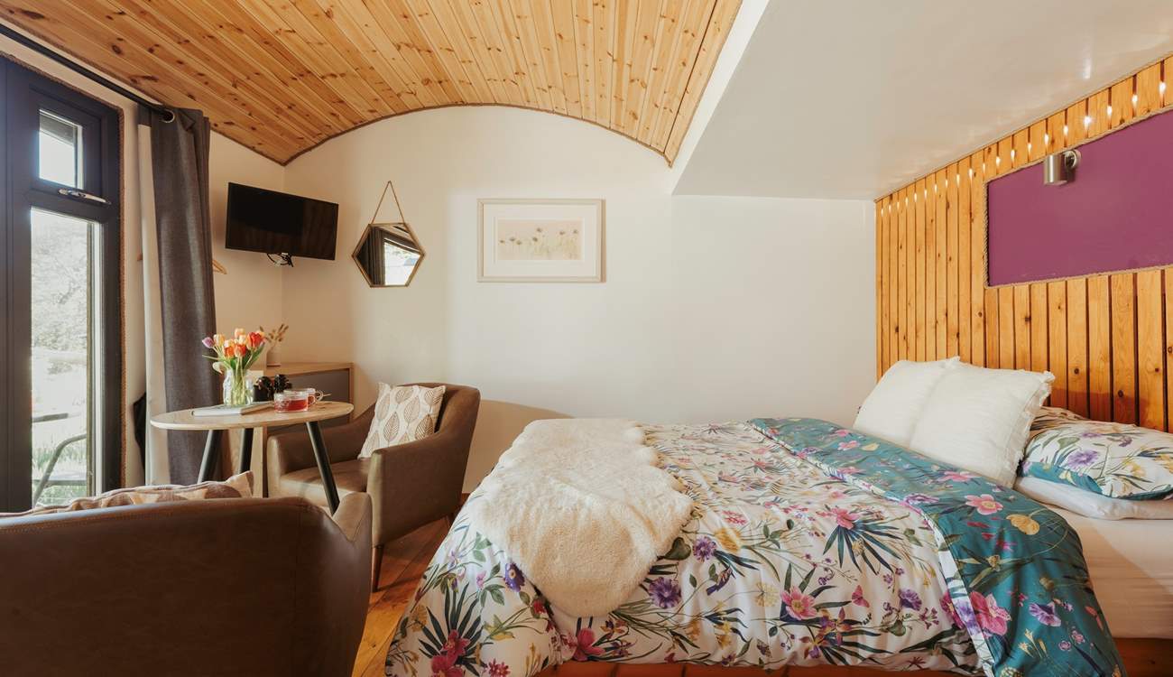The curved ceiling and wooden panels create the cosiest atmosphere.