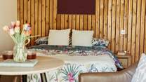 The sumptuous double bed promises a blissful night's rest. 