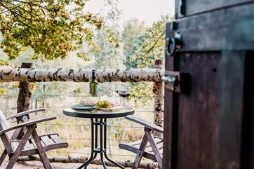 Step out onto the deck and enjoy dining amongst the leafy trees.