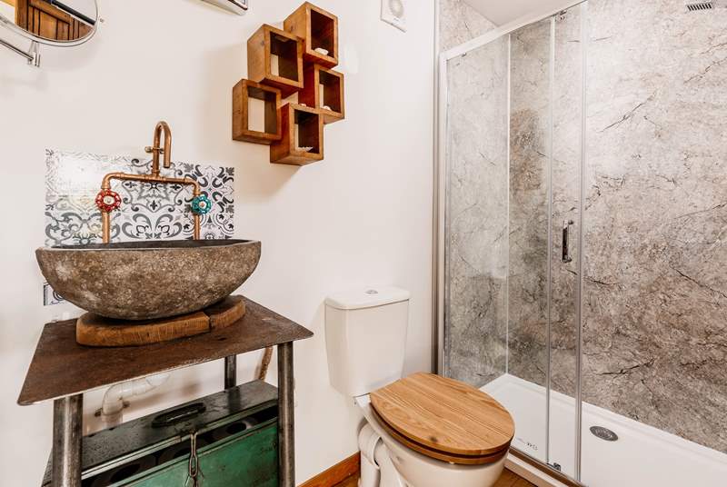 The stylish shower-room is perfect for freshening up after a day of adventures. 