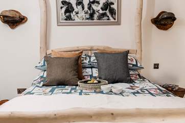 The handcrafted four-poster bed is simply the most stunning feature.