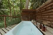 Or soak in the outdoor bathtub as you listen to the sweet sound of birdsong.