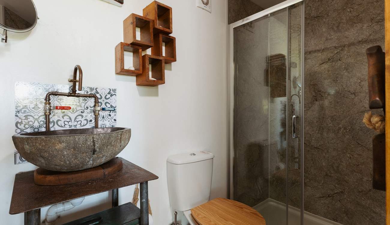 The stylish shower-room is perfect for freshening up after a day of adventures. 