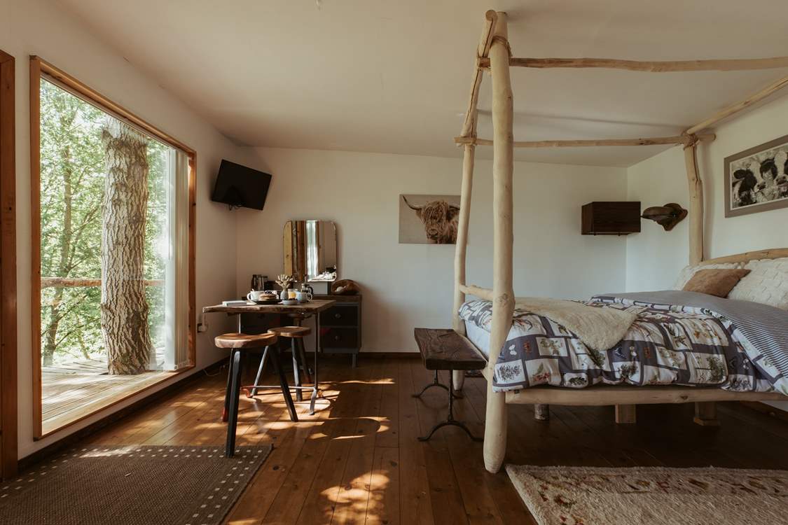 With just trees surrounding you, watch the world go by from the comfy bed.