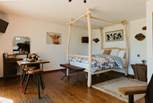 Quirky, handcrafted furniture fills the treehouse, making it the most unique retreat. 